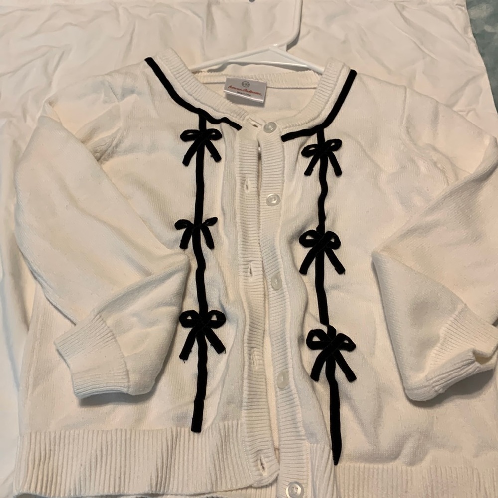 Hanna Anderson white /cream cardigan with black velvet bow detail size 120
